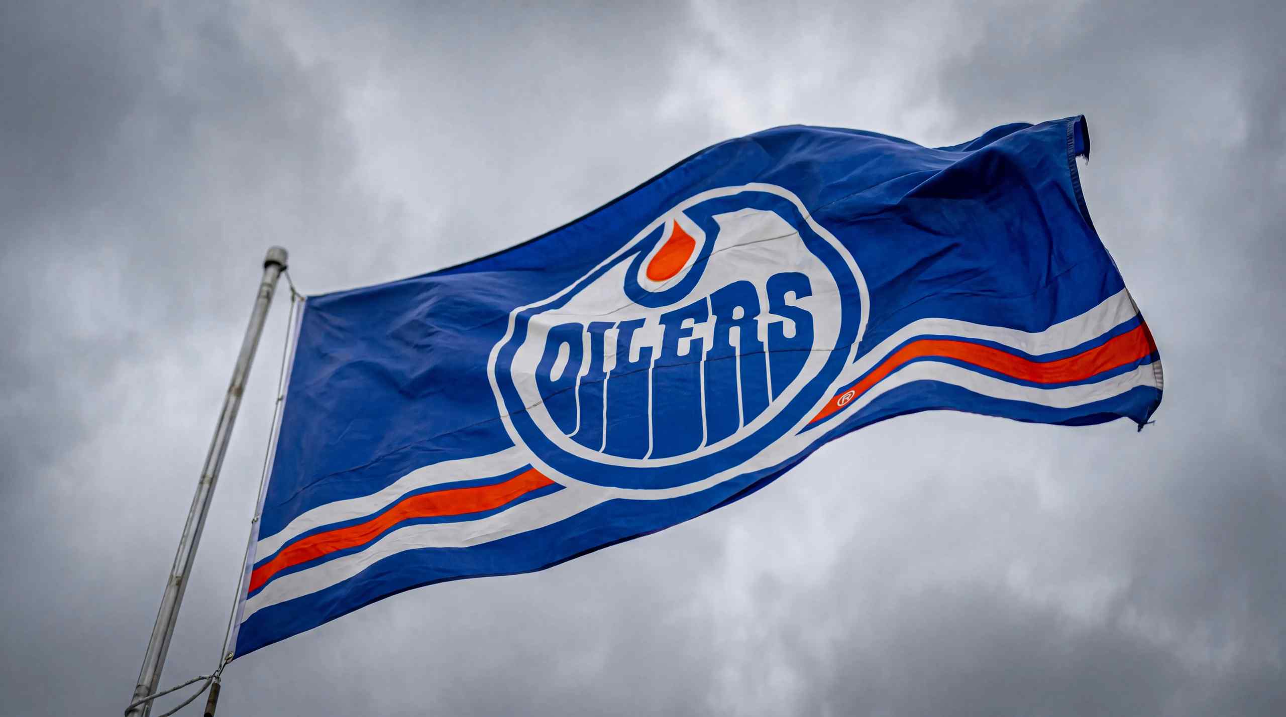 An Edmonton Oilers flag blowing in the wind.